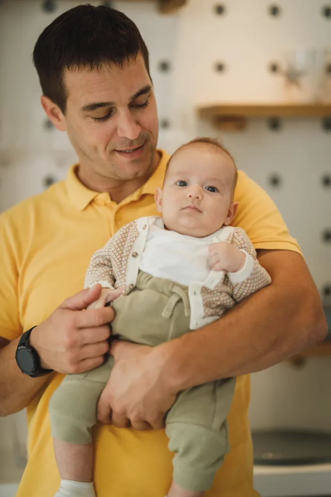 Father holding his smiling baby