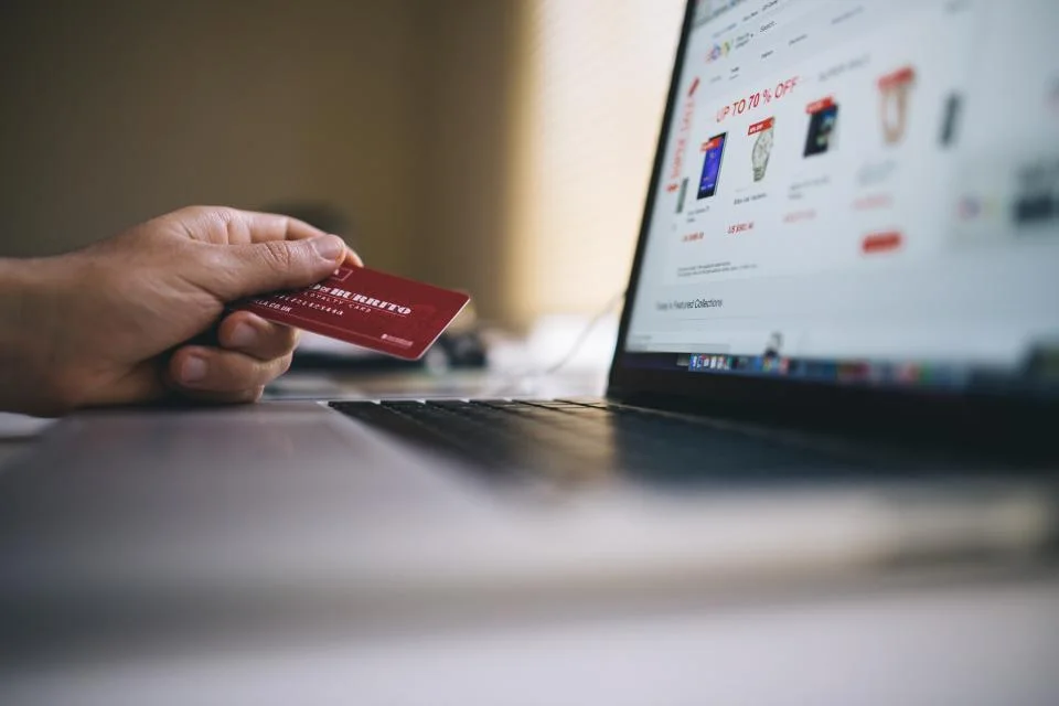 Parent comparing rotating car seat prices online before buying